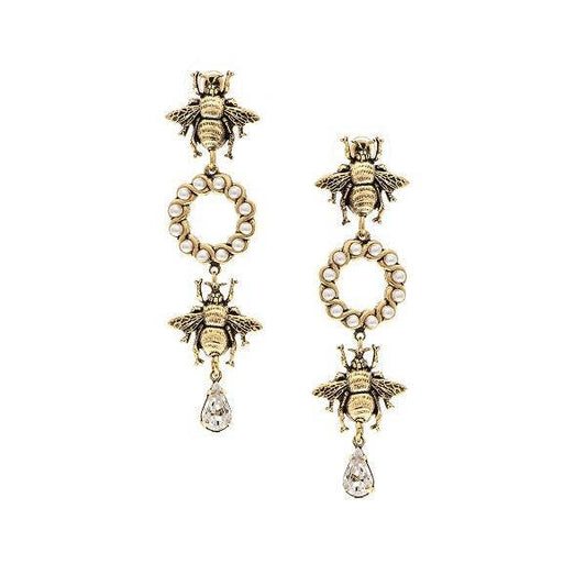 A pair of earrings featuring pearl hoops with bee accents and hanging crystal pendants, 22K antique gold plated over brass.