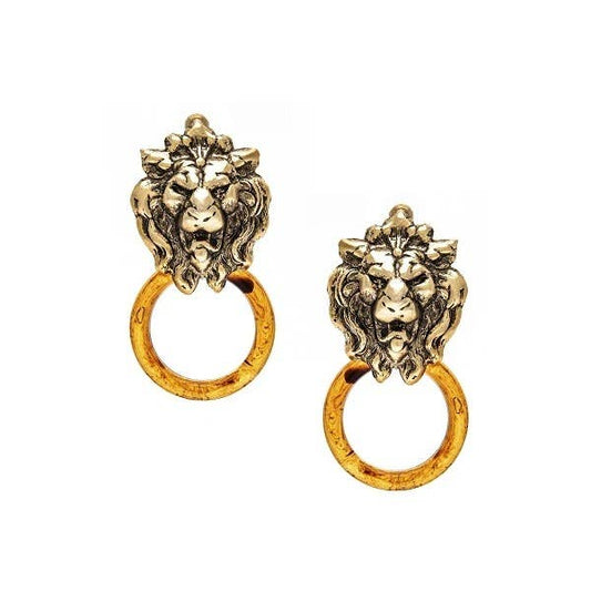 A pair of gold-colored lion earrings with red-orange accents, featuring a hoop design, displayed against a white background.