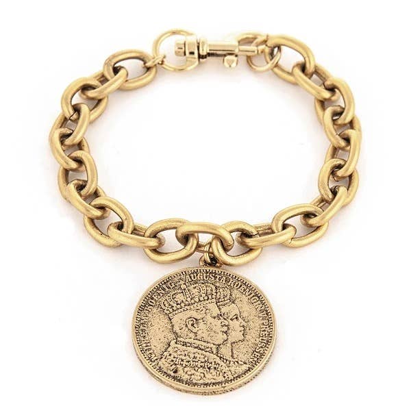 A gold-colored vintage-inspired Roman coin bracelet with a large medallion pendant on a chain.