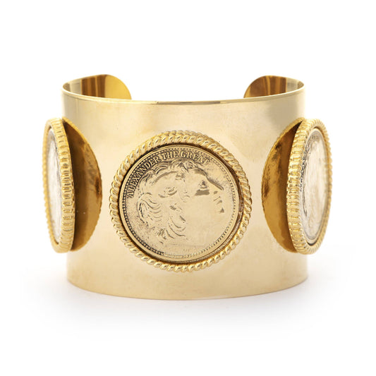 A gold-colored cuff bracelet with intricate coiled edges and vintage-inspired Roman coin Large cuff design, featuring several coin-like embellishments on a circular pattern.