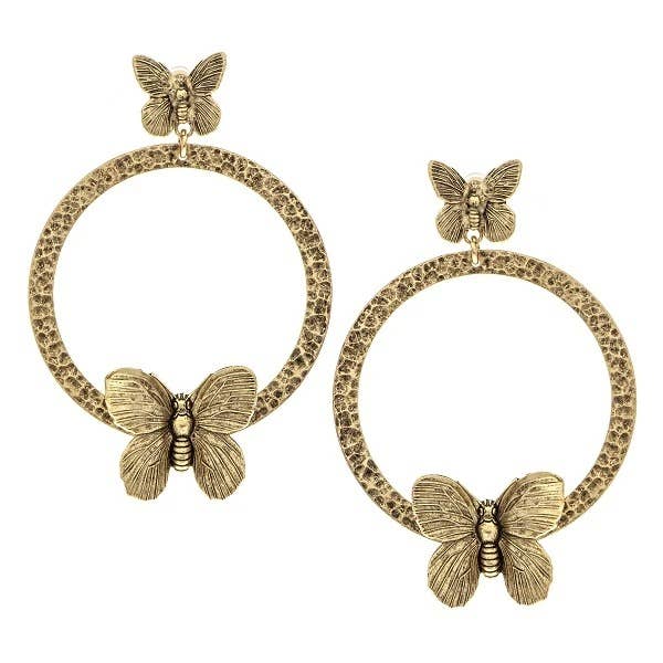 A pair of gold-plated brass earrings featuring double butterfly designs with an artistic footprint along the hoop.