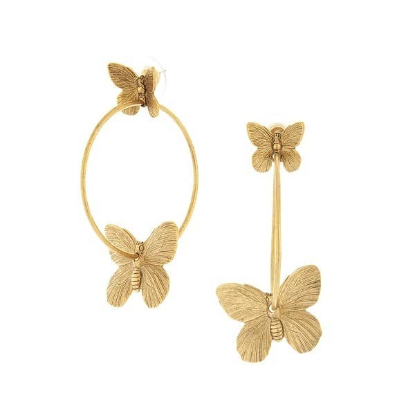 A pair of gold-colored butterfly hoop earrings on a white background
