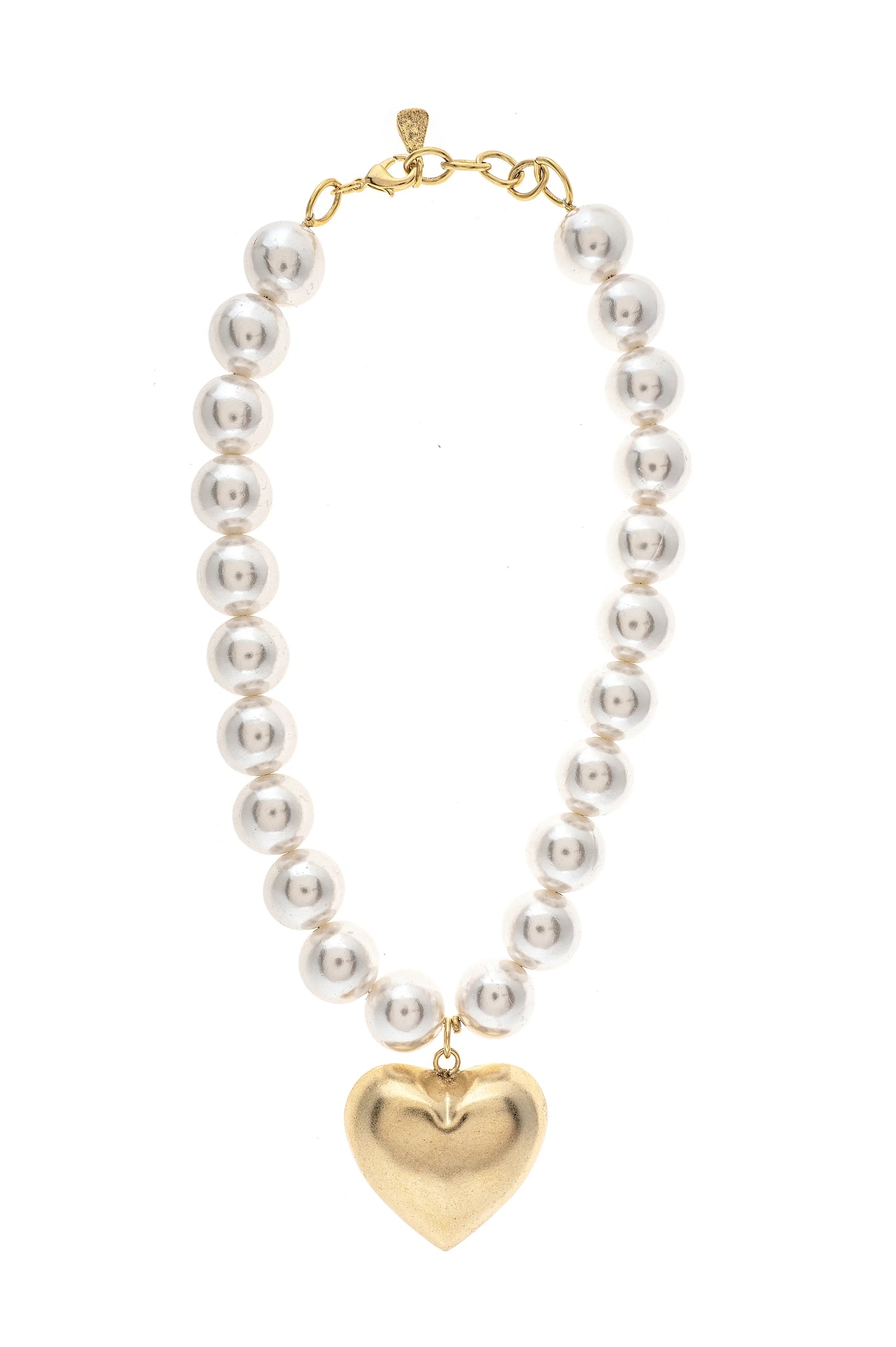 A vintage heart-shaped necklace with white glass beads and a gold-colored pendant, handcrafted in New York.