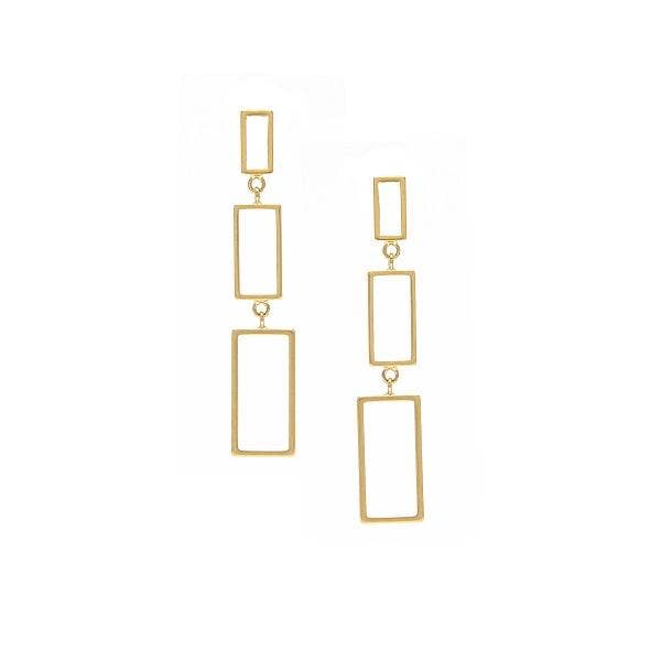 A pair of silver-plated hoop earrings with a geometric wavy design, hanging from the ear.
