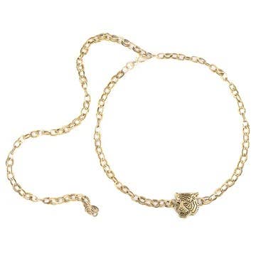 A gold-colored belt with a embellished tiger buckle, displayed against a white background.