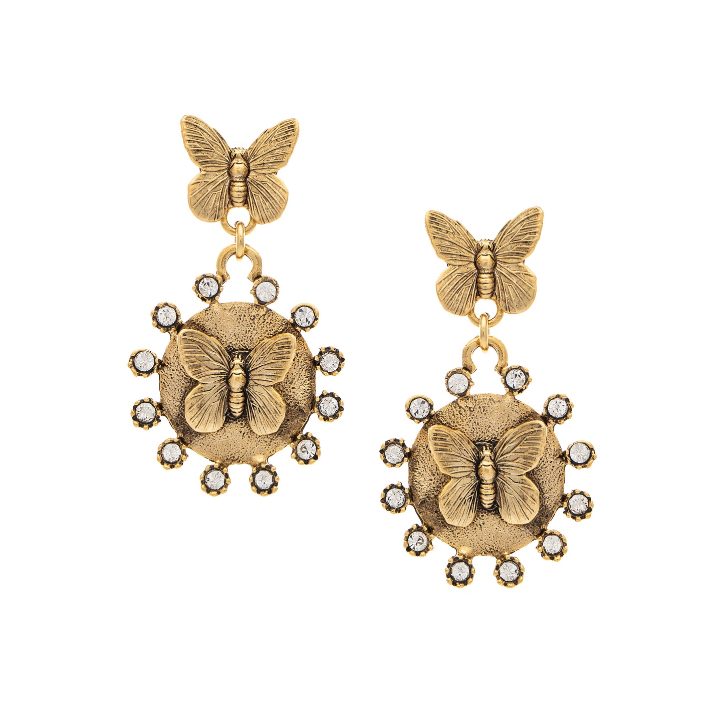 Gold butterfly earrings with circular designs and small stones on a white background