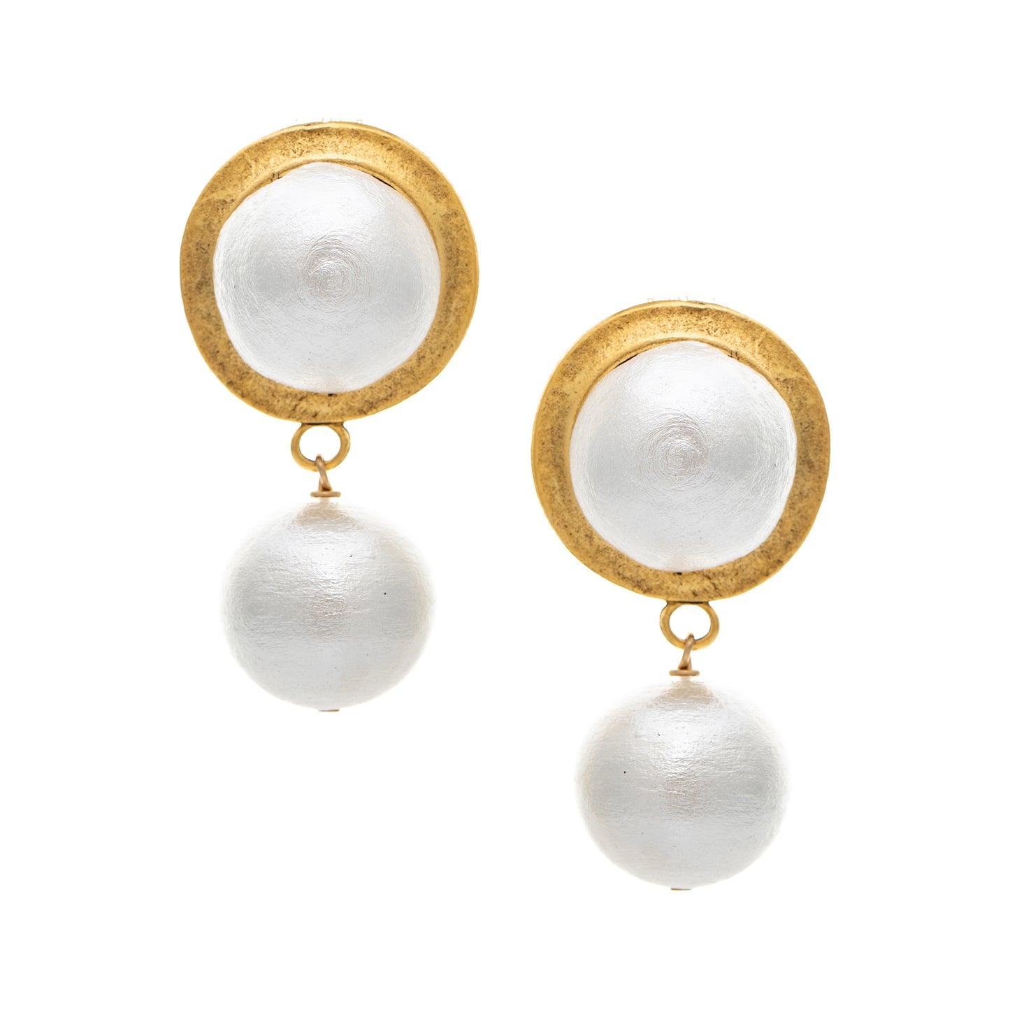 Pair of earrings with gold circular tops and white spherical drops on a white background
