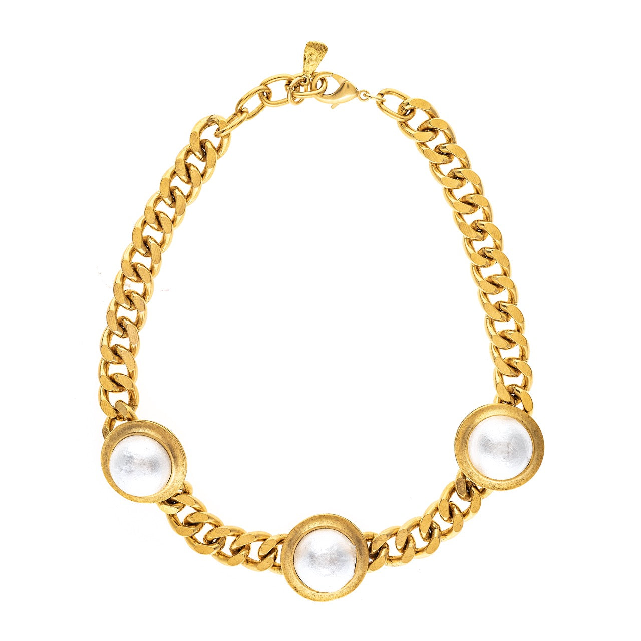 Gold chain bracelet with pearl-like beads on a white background