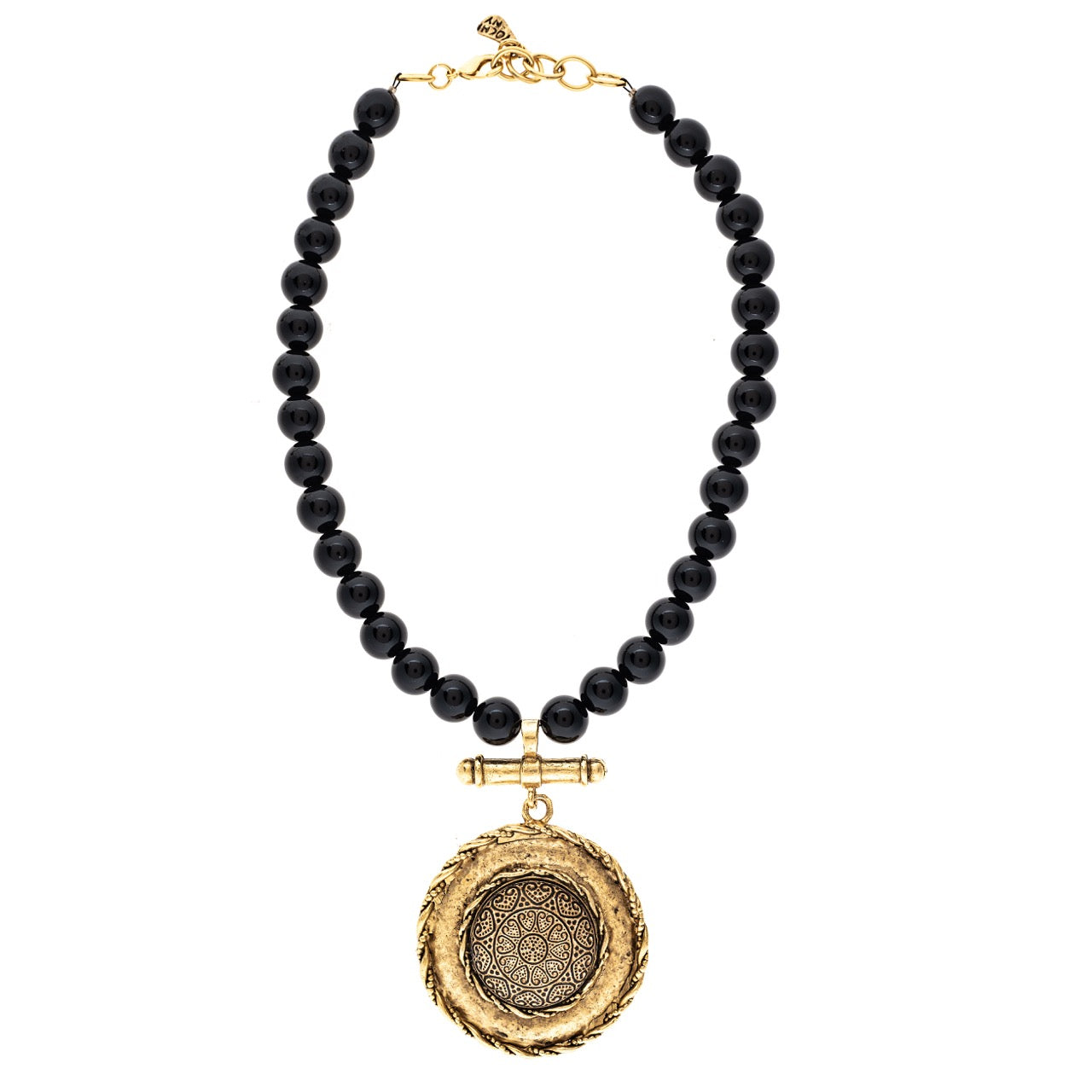 Black beaded necklace with a gold pendant on a white background