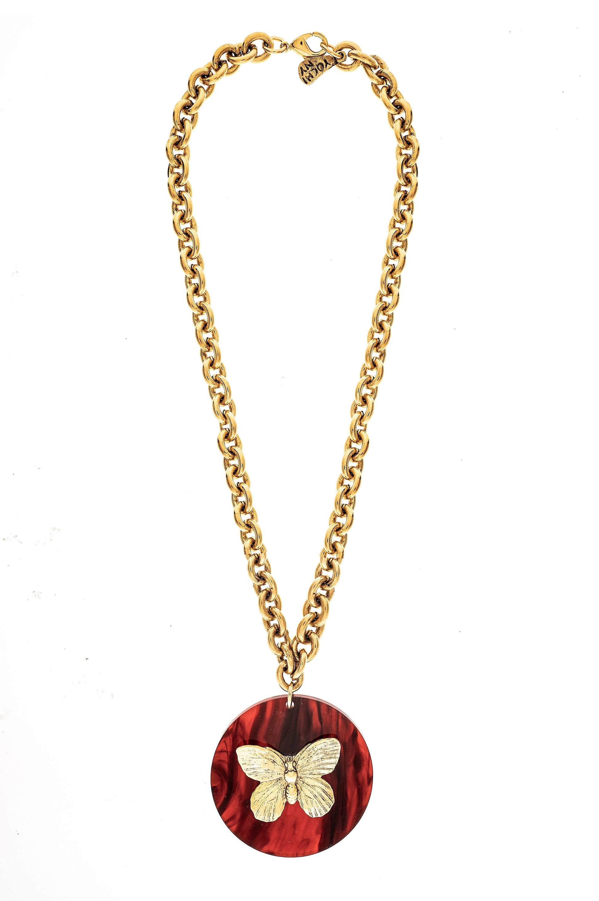 A gold-plated necklace with a circular red pendant featuring a gold butterfly design, displayed on a plain background.