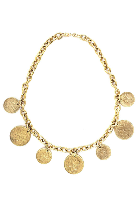 A gold-colored necklace with multiple circular charms representing Roman coins, displayed against a plain background.