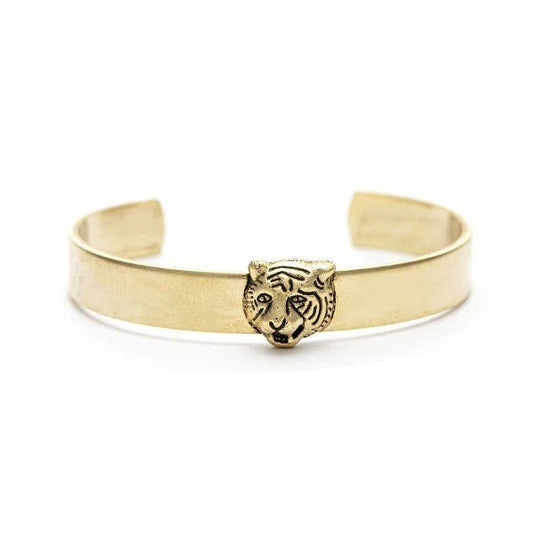 A gold-colored cuff bracelet with a crafted tiger head design in the center, displayed against a white background.