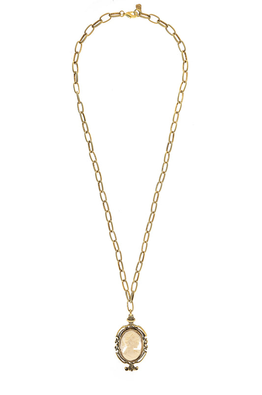 A gold-colored necklace with a small, oval-shaped pendant.
