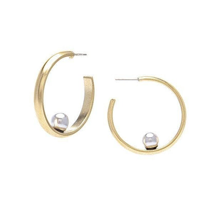 A pair of gold-colored earrings featuring a cuff design with a pearl sitting horizontally in the center.