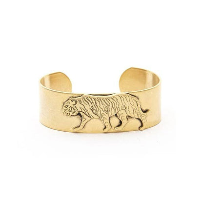 A 22K antique gold plated brass bracelet with a medium cuff featuring a lion design, handcrafted in New York.