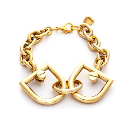 A gold-plated interlocked bracelet with a D-shaped design, featuring a clasp, on a white background.