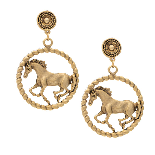 Gold horse earrings on a white background
