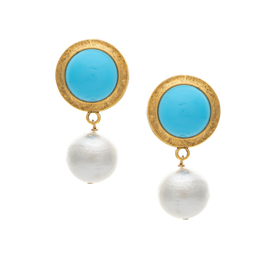 Pair of earrings with turquoise stones and pearl drops on a white background
