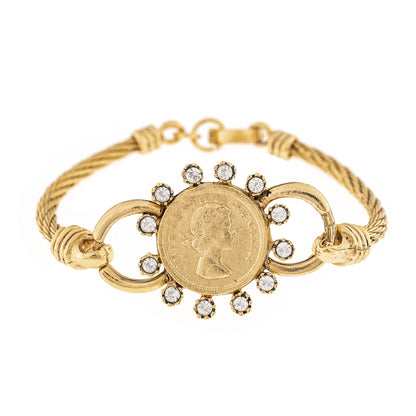 Gold bracelet with coin and gemstone design on a white background