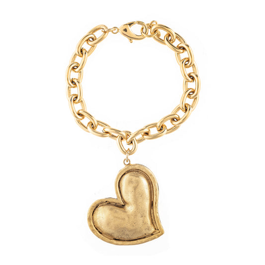 Gold chain bracelet with a heart-shaped charm on a white background