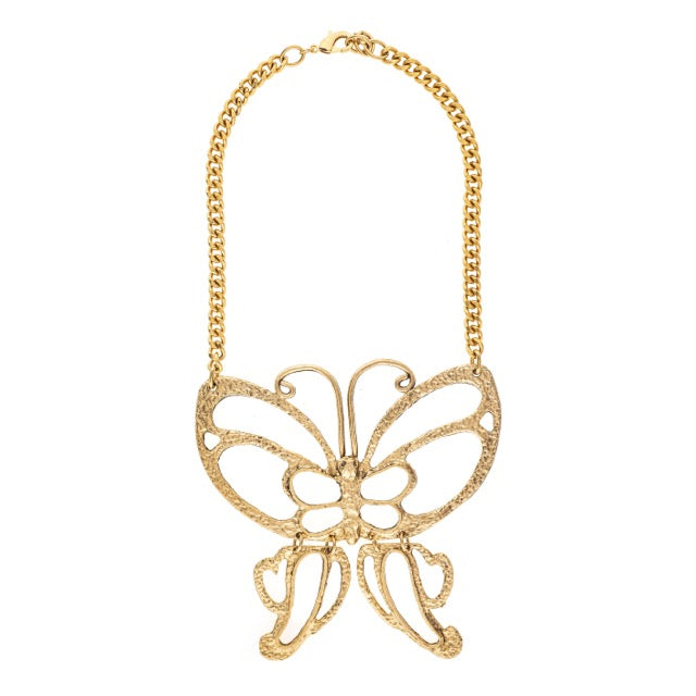 Gold butterfly necklace on a white background
