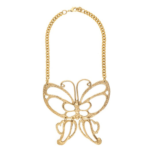 Gold butterfly necklace on a white background