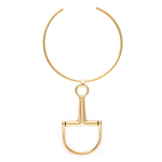 Gold equestrian bit necklace on a white background