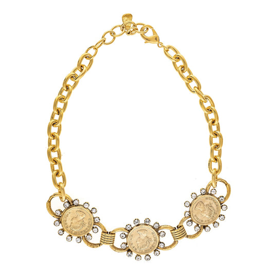 Gold chain bracelet with coin-like elements on a white background