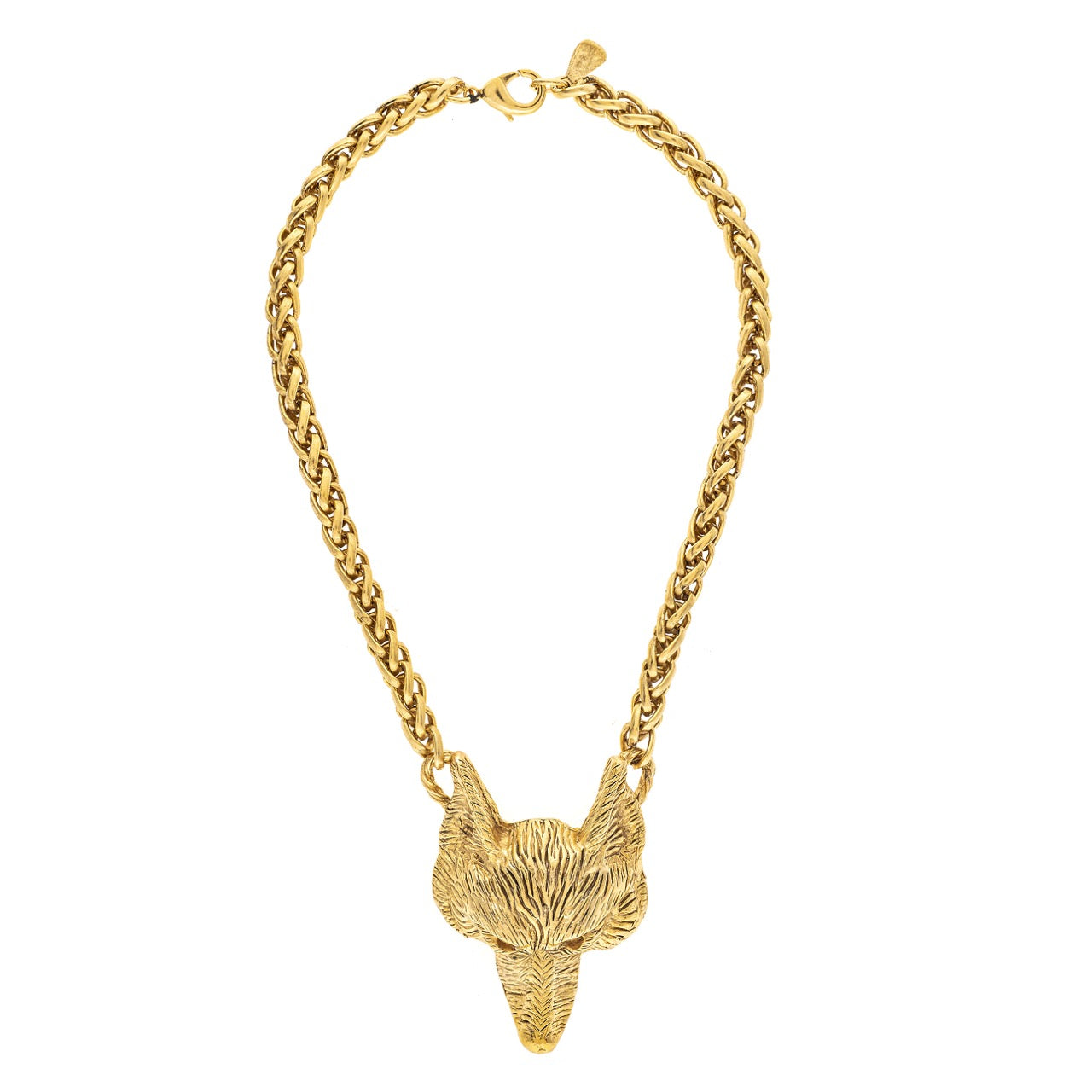 Gold chain necklace with a fox head pendant on a white background
