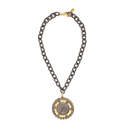 Necklace with a coin pendant on a white background