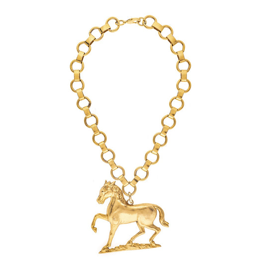 Gold bracelet with a horse pendant on a white background