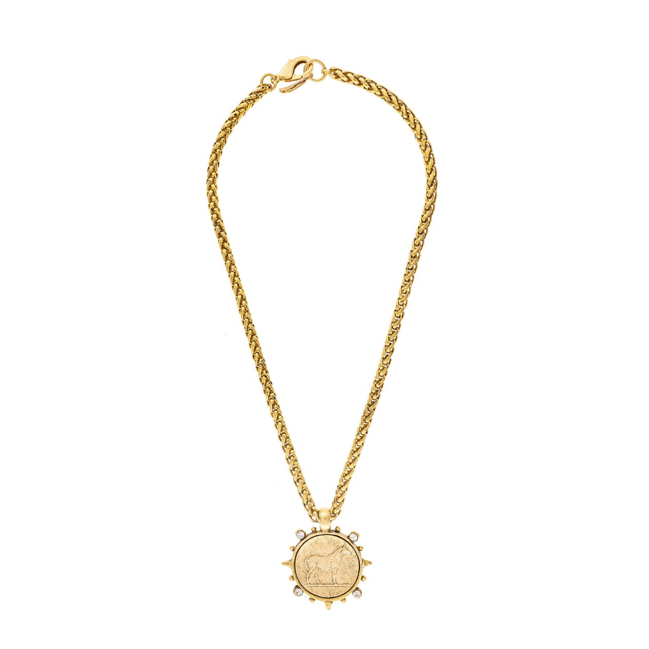 Gold necklace with a circular pendant on a white background