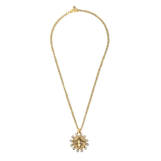 Gold necklace with a floral pendant on a white background