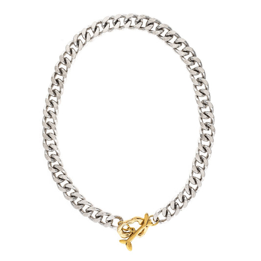 Silver chain bracelet with a gold clasp on a white background