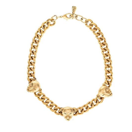 Gold chain necklace with panther head links on a white background
