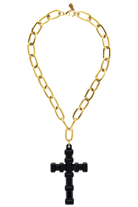 Gold chain necklace with a black cross pendant on a white background