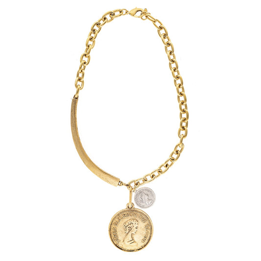 Gold necklace with coin charms on a white background