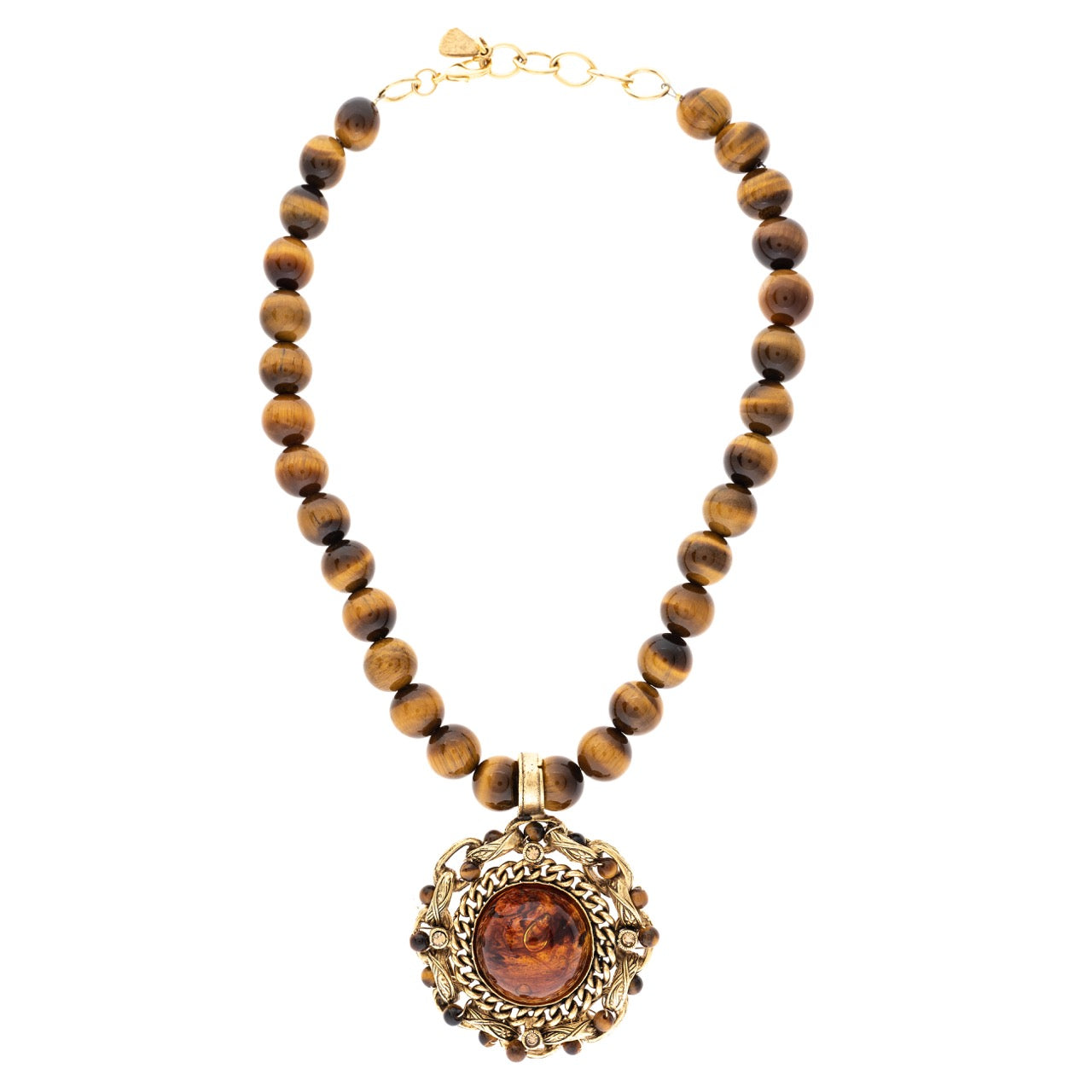Necklace with wooden beads and a decorative pendant on a white background