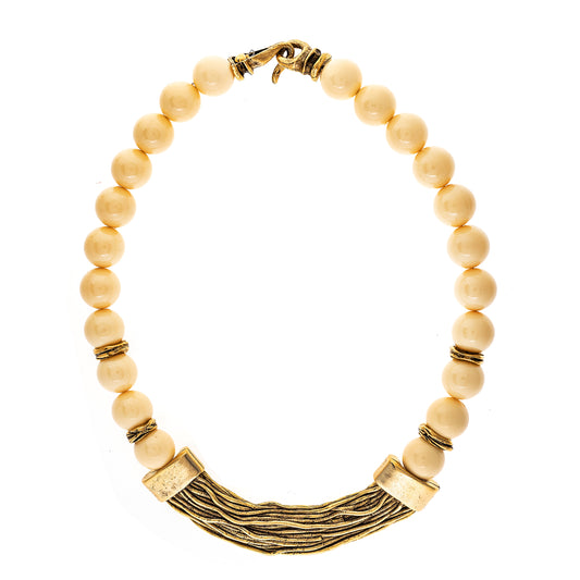 necklace with beige beads and gold accents on a white background