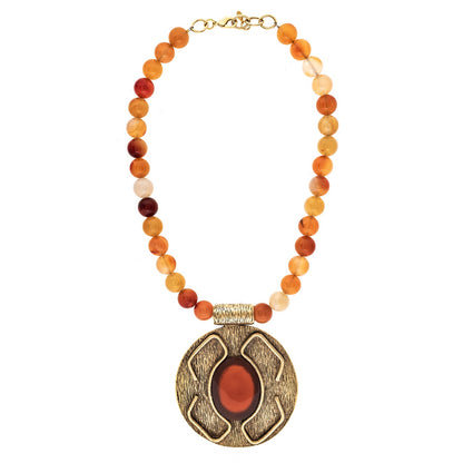 Necklace with multicolored beads and a large decorative pendant on a white background