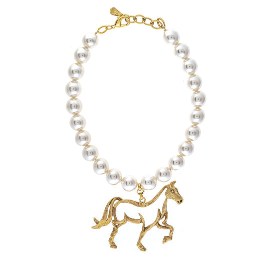 Pearl necklace with a gold horse pendant on a white background