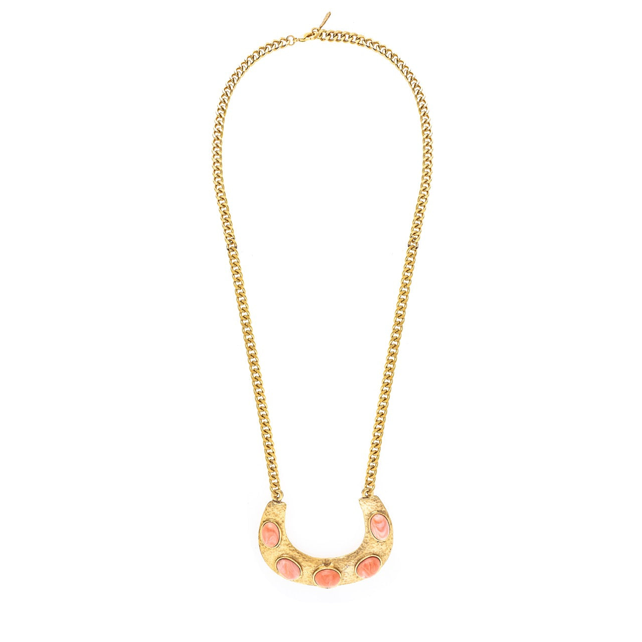 Gold necklace with a pink crescent moon pendant on a white background