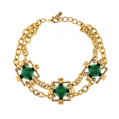 A multi-layered gold chain necklace with green tri-colored accents, featuring a clasp and decorative elements.