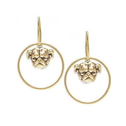 A pair of gold-colored bulldog earrings mounted on hoop earrings