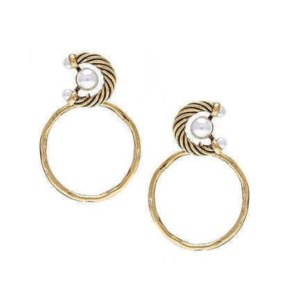 A pair of gold-colored hoop earrings with pearl accents, featuring a textured design and antique gold plating, sourced from Florence, Italy.