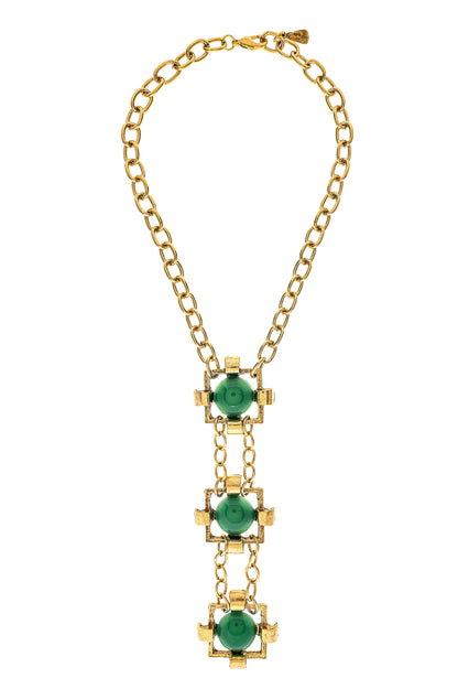 A gold-plated brass necklace with green stone accents, featuring a chain link design and three square-shaped green stones aligned vertically.